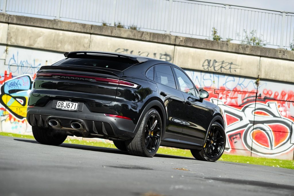 Porsche Cayenne Turbo GT rear quarter angle, with graffiti wall