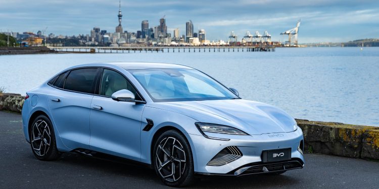 BYD Seal parked in front of Auckland skyline