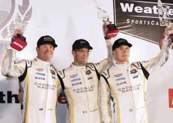 Scott Dixon and Petit Le Mans teammates holding up throphies