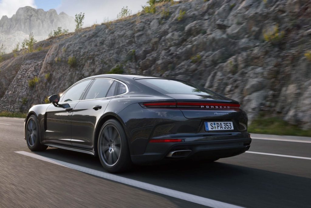 2024 Porsche Panamera driving past rock face