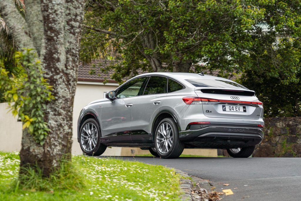 Audi Q4 50 e-tron Sportback taking a corner, showing the rear