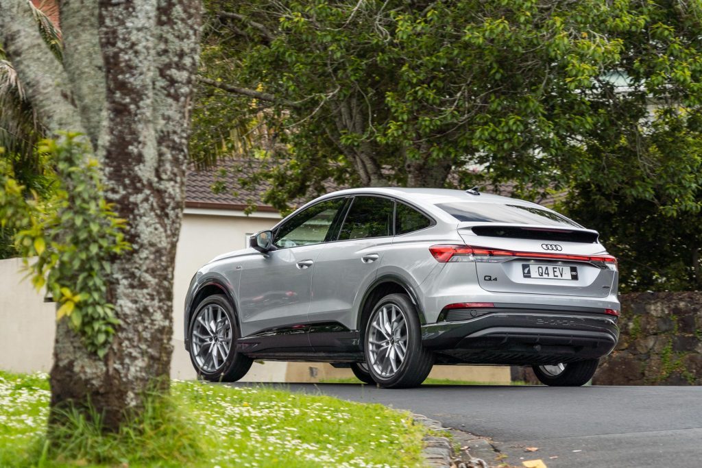 Audi Q4 Sportback 50 e-tron quattro S line taking a corner, shown from rear