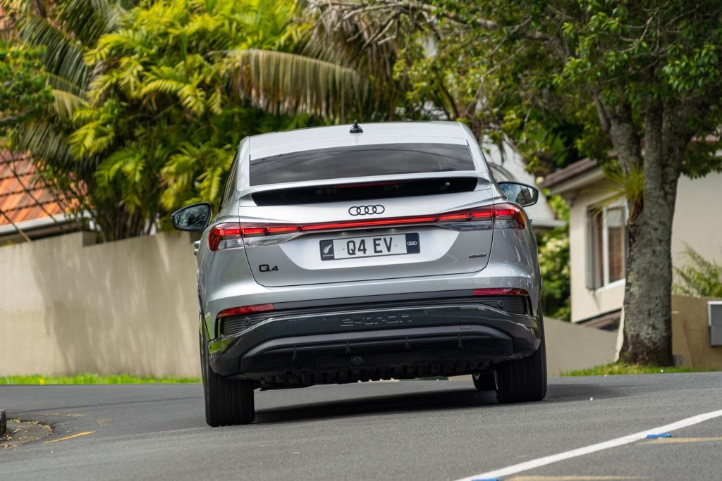 Audi Q4 Sportback 50 e-tron quattro S line rear view, cornering