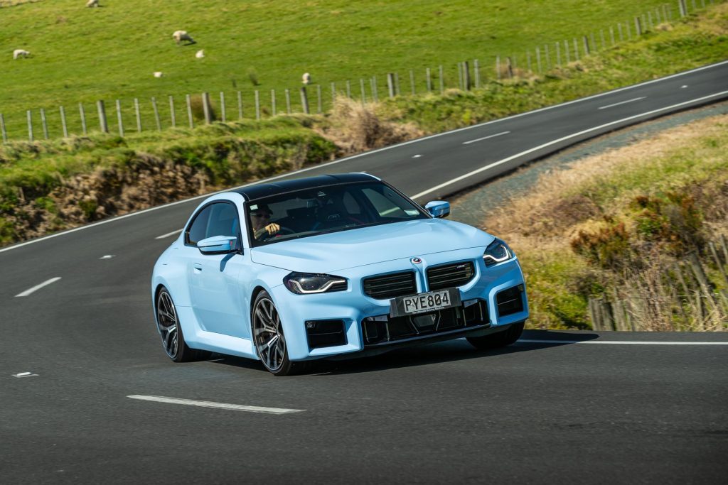 BMW M2 Performance in blue, cornering hard