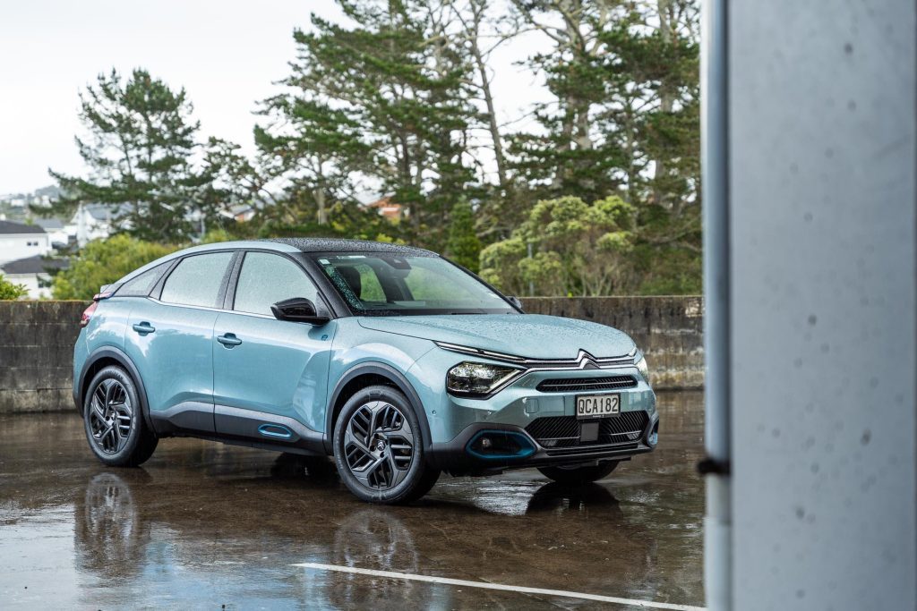 Citroen e-C4 Shine in blue, parked in the rain