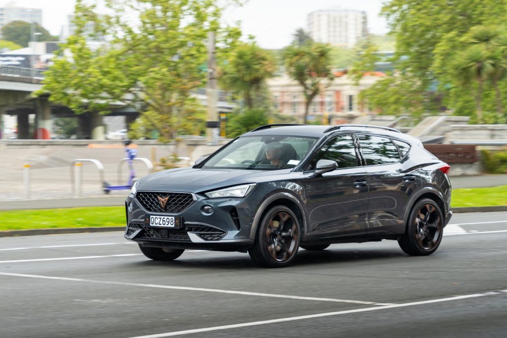 Cupra Formentor V e-Hybrid panning shot, front angle