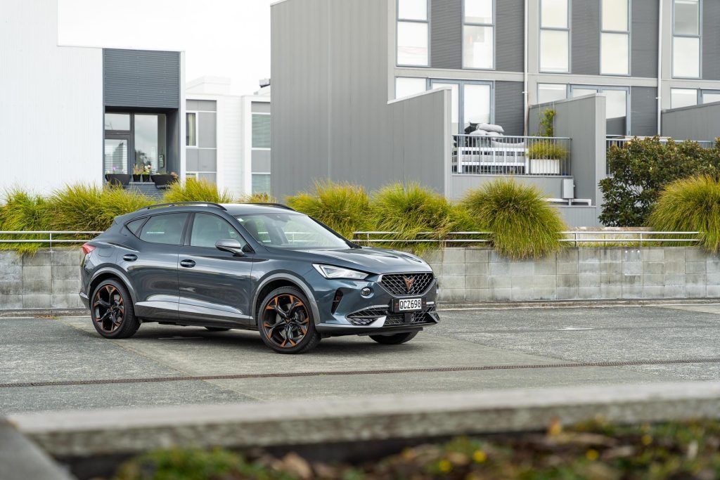 Cupra FOrmentor V e-Hybrid parked near apartments