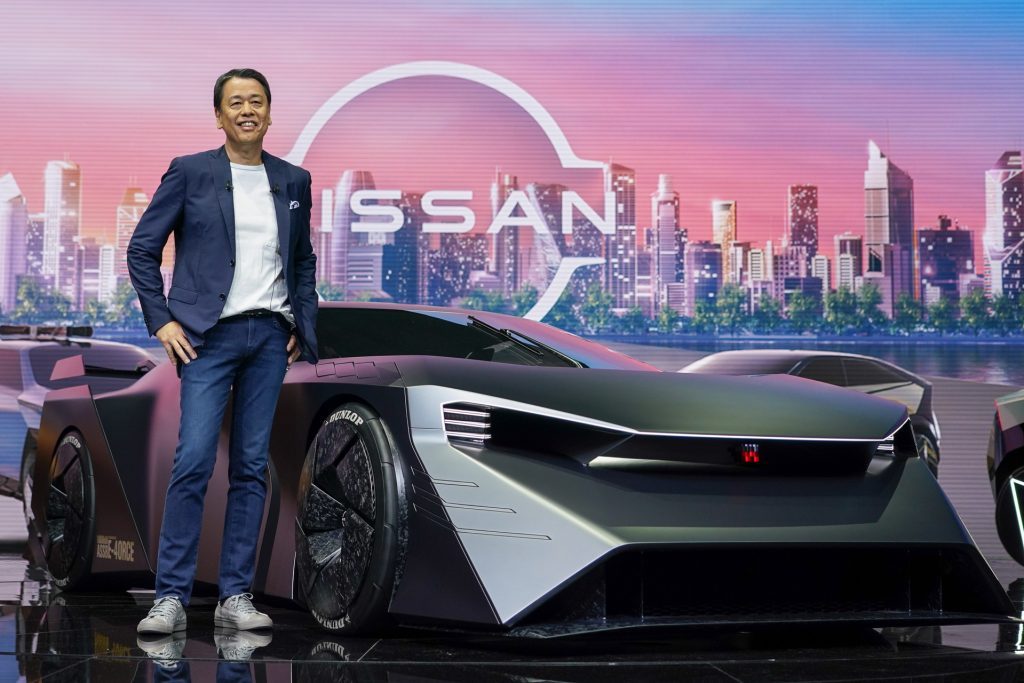 Nissan CEO standing next to the Nissan Hyper Force concept