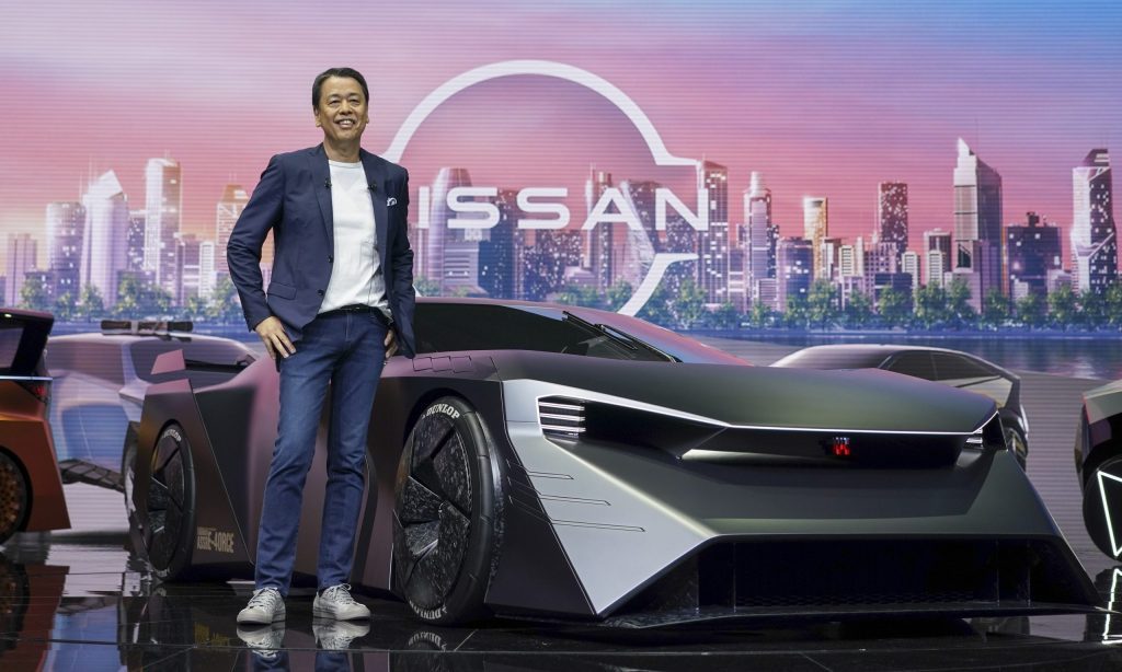 Makoto Uchida next to the Nissan Hyper Force