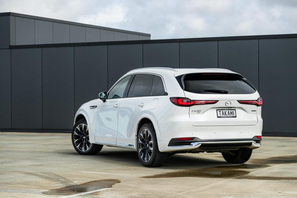 Mazda CX-90 Takami rear quarter view, in white