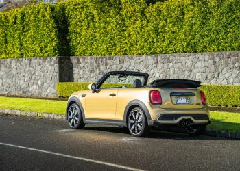 Mini Cooper S Convertible rear view, with roof down, in gold
