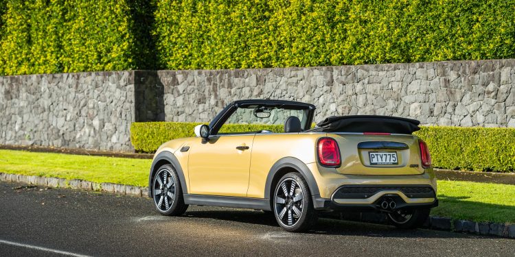 Mini Cooper S Convertible rear view, with roof down, in gold