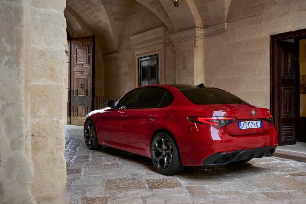 Alfa Romeo Giulia in Rosso Alfa red rear three quarter view