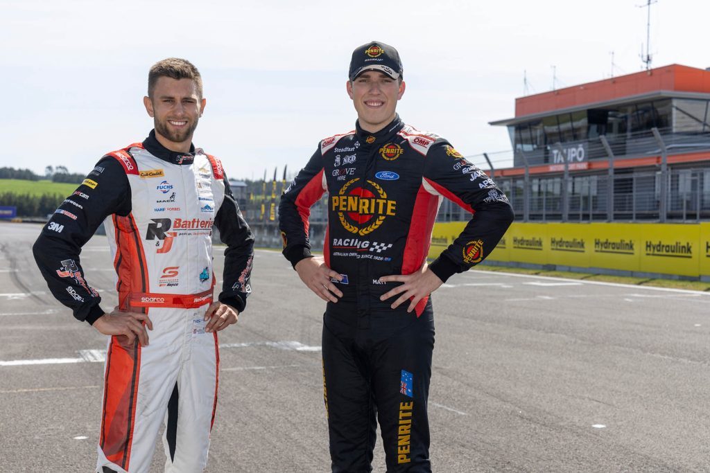 Andre Heimgartner and Matt Payne standing on grid at Taupo International Motorsport Park