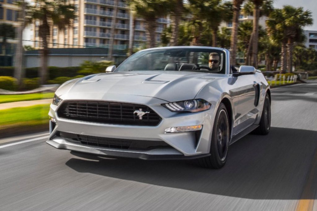 Sixth generation Ford Mustang GT/CS convertible driving on road 