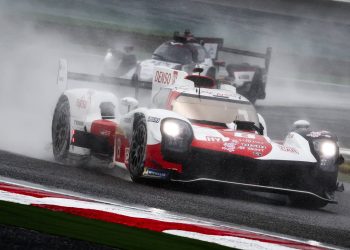 Toyota GR010 racing in heavy rain