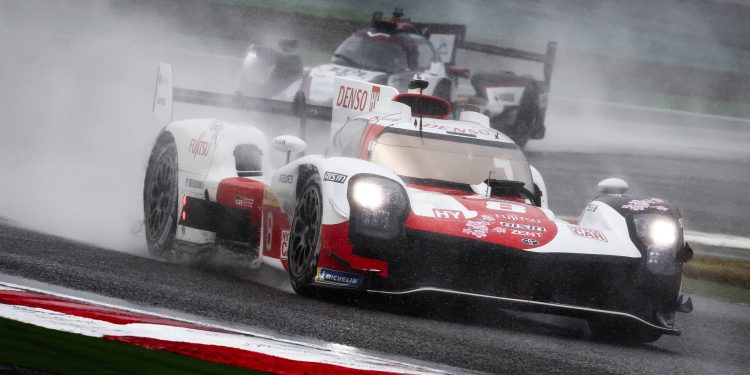 Toyota GR010 racing in heavy rain