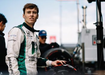 Marcus Armstrong standing in IndyCar pitlane