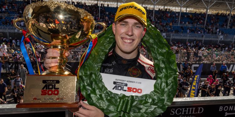 Matt Payne holding up Adelaide 500 race winning trophy