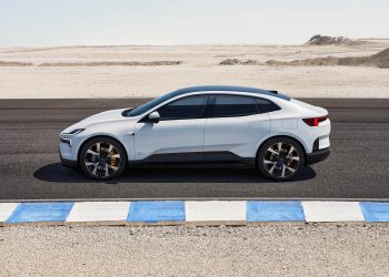 Side profile view of Polestar 4 on race track in desert