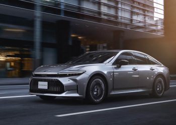 Toyota Crown Sedan driving on city street