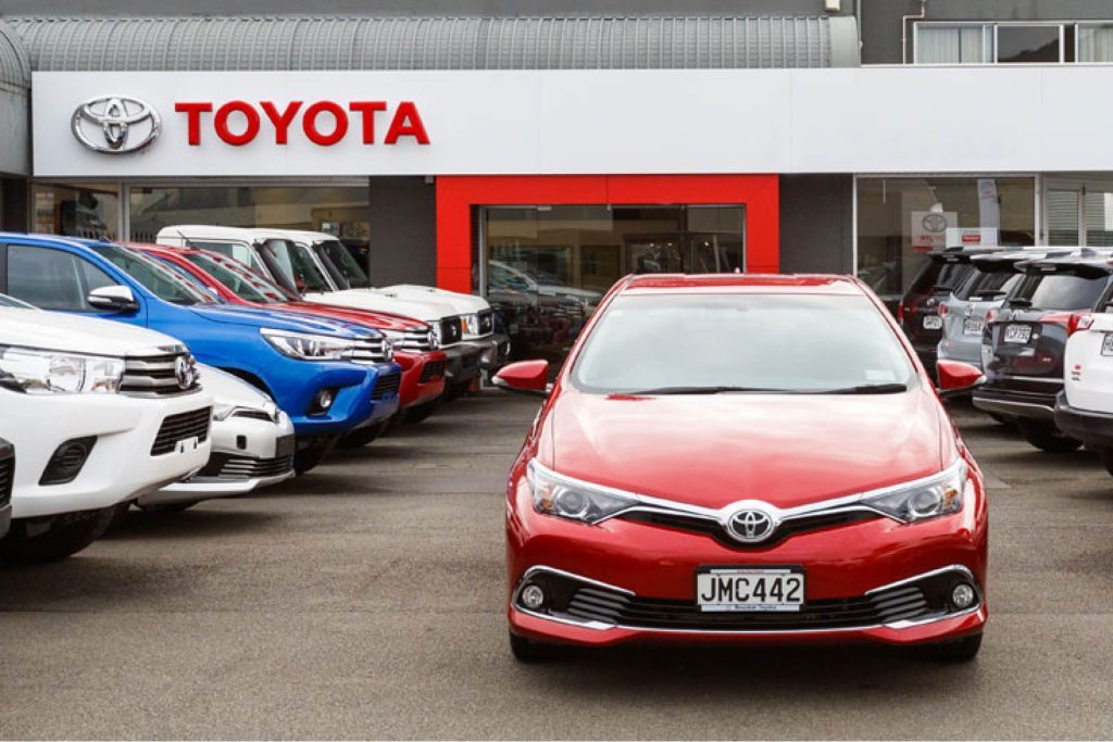 Toyota Corolla parked in front of dealership in NZ