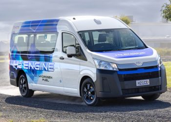 Hydrogen-fuelled Toyota Hiace driving on gravel road