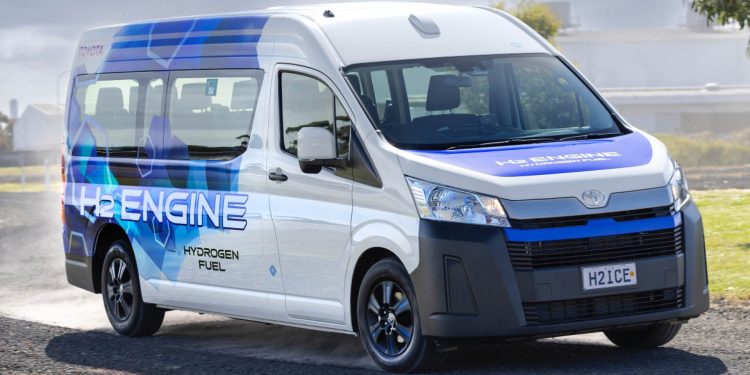 Hydrogen-fuelled Toyota Hiace driving on gravel road