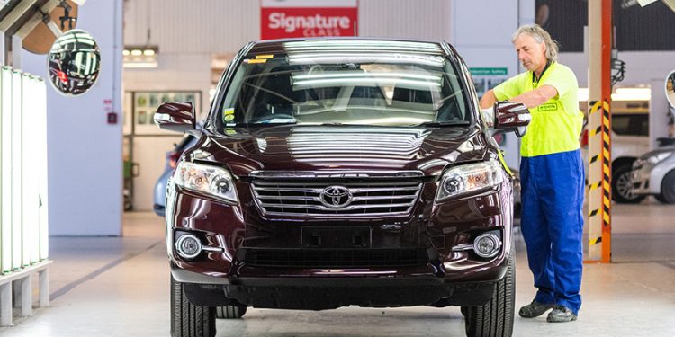 Used Toyota being inspected by technician