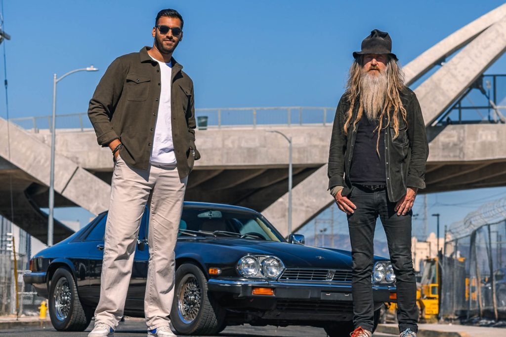 Kyzyl Saleem and Magnus Walker standing in front of Jaguar XJS