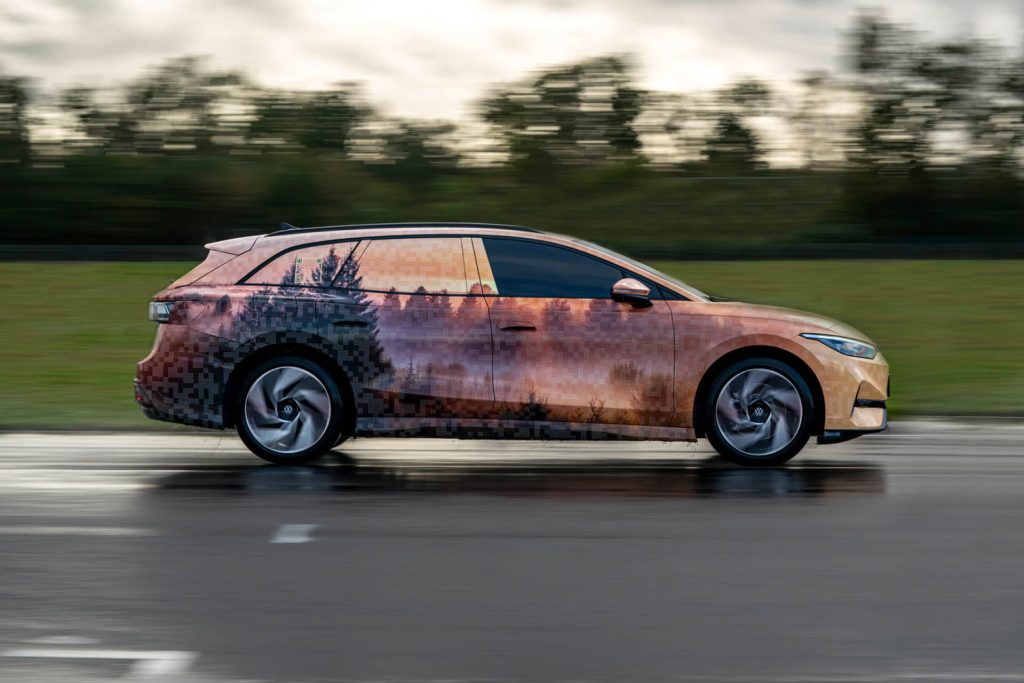 Volkswagen ID.7 Tourer driving on road in camouflage