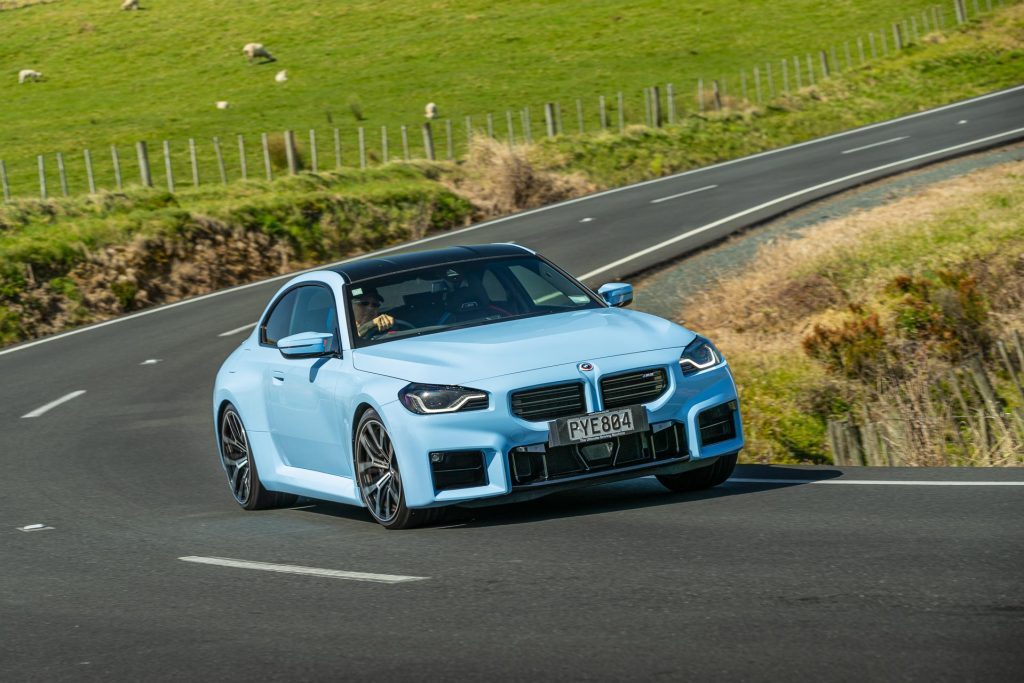 BMW M2 Competition taking a corner, pictured in blue