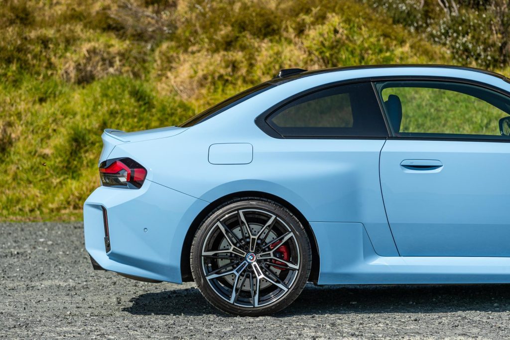 Rear quarter and wheel detail shot, showing large brakes on the BMW M2 Competition