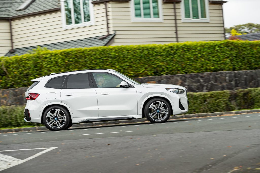 BMW iX1 xDrive30 panning side profile