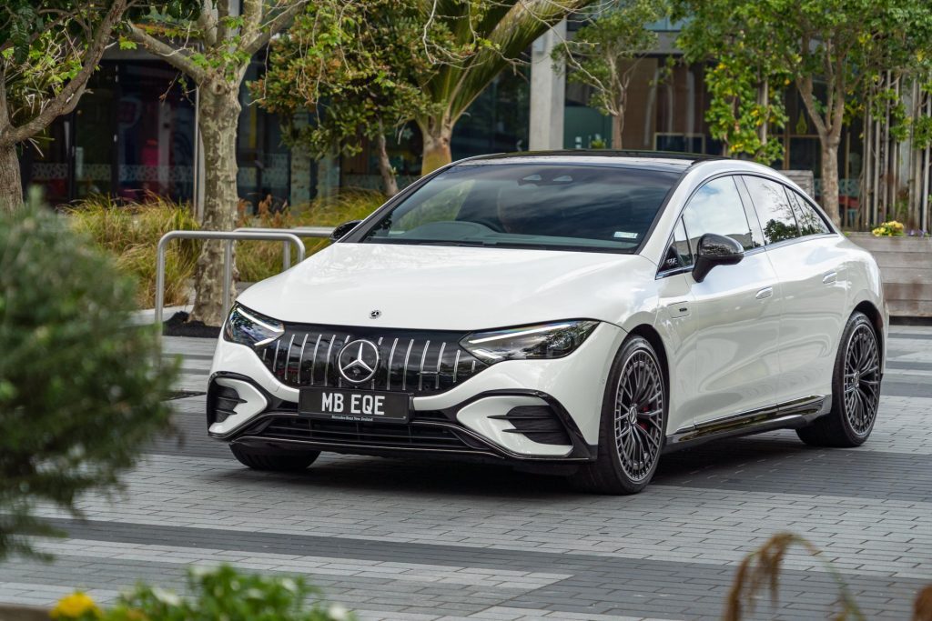 Mercedes-AMG EQE 53 in white, crawling through a mall carpark