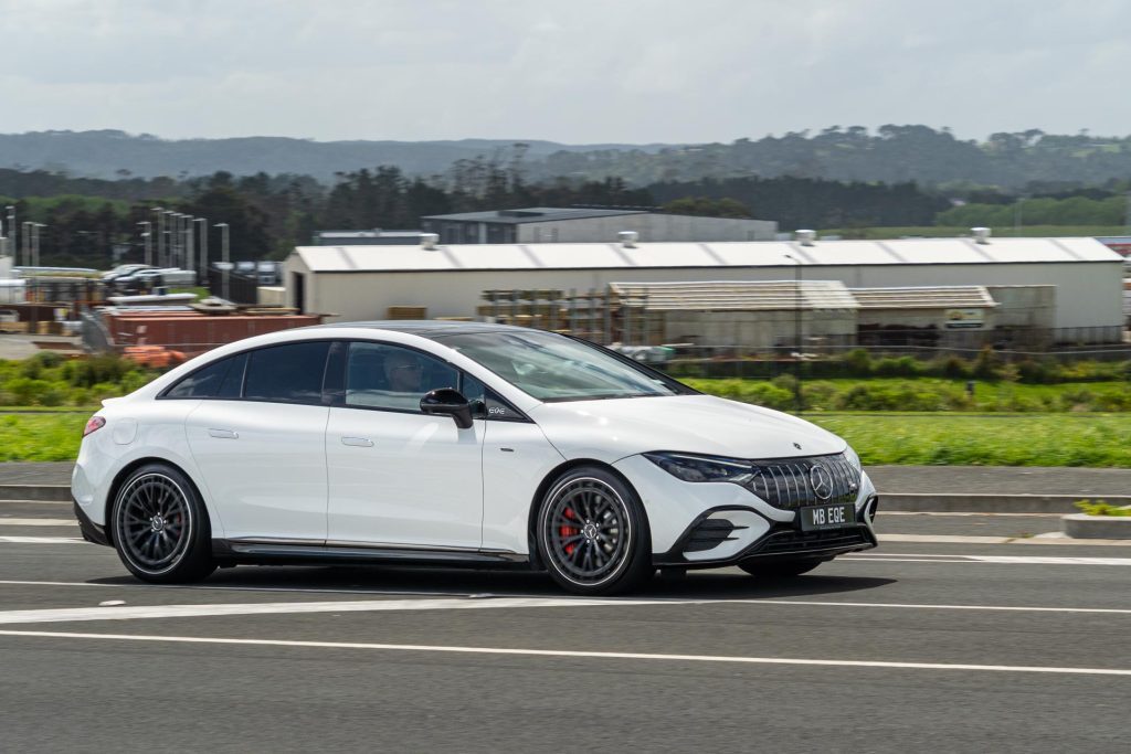 Side profile panning shot of the Mercedes-AMG EQE 53