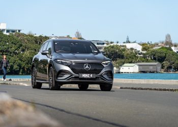 Mercedes-Benz EQS 450 driving on the waterfront
