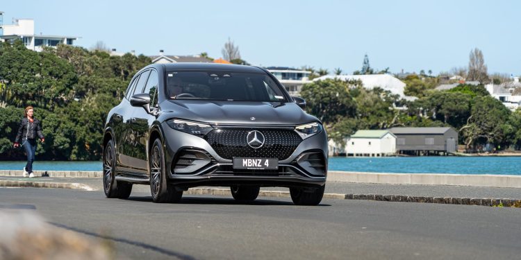 Mercedes-Benz EQS 450 driving on the waterfront