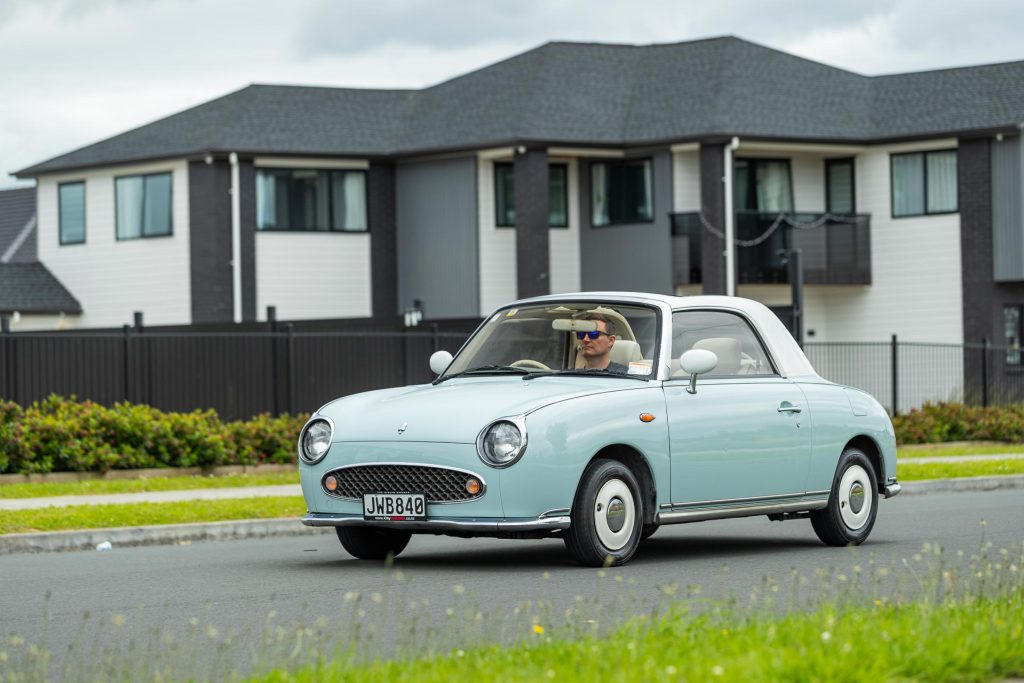 Nissan Figaro driving shot, front end