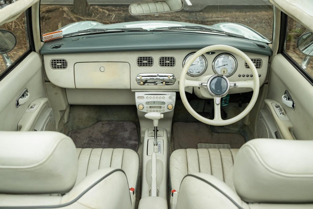 Nissan Figaro interior view, white interior