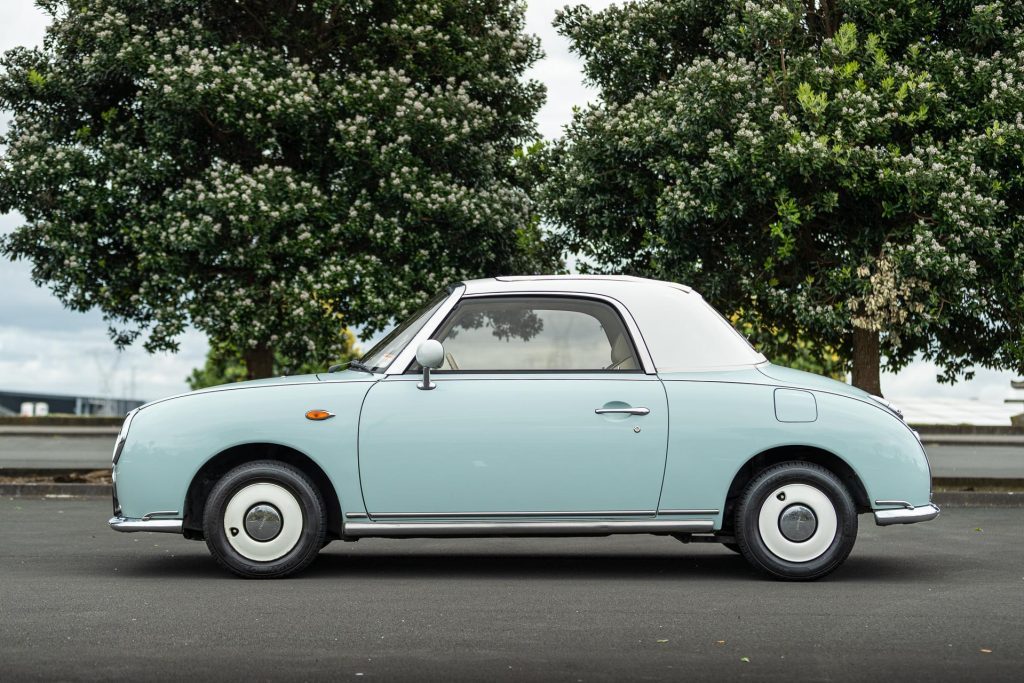 Nissan Figaro side profile with white hubcaps