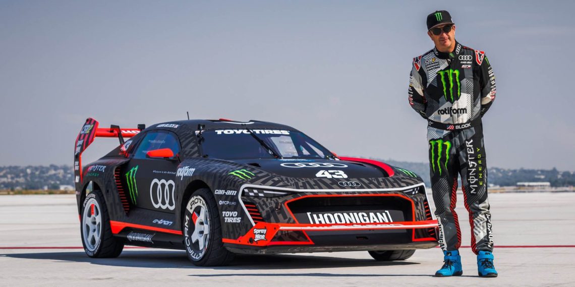 Ken Block standing next to Audi S1 Hoonitron