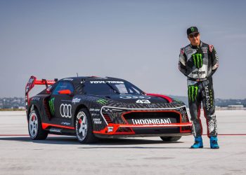 Ken Block standing next to Audi S1 Hoonitron