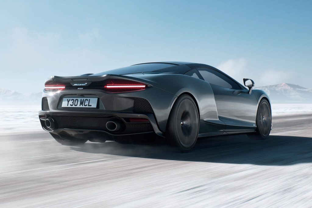 McLaren GTS driving on snowy road