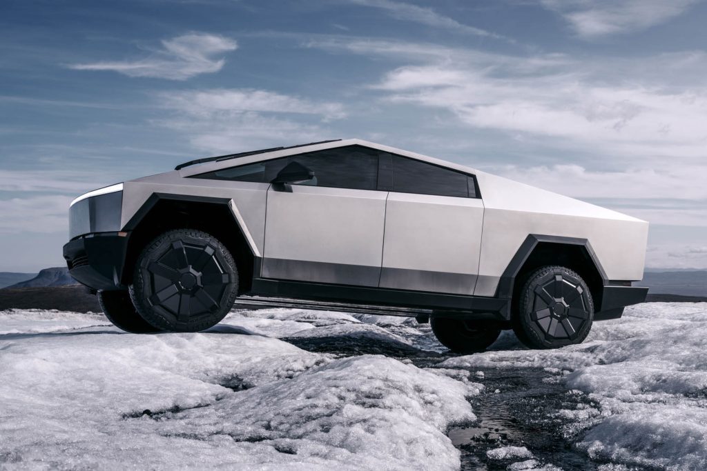 Tesla Cybertruck driving over snow