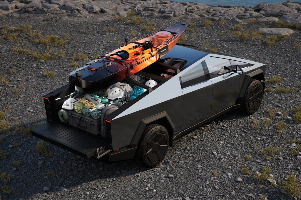 Tesla Cybertruck with loaded tray and kayak on roof