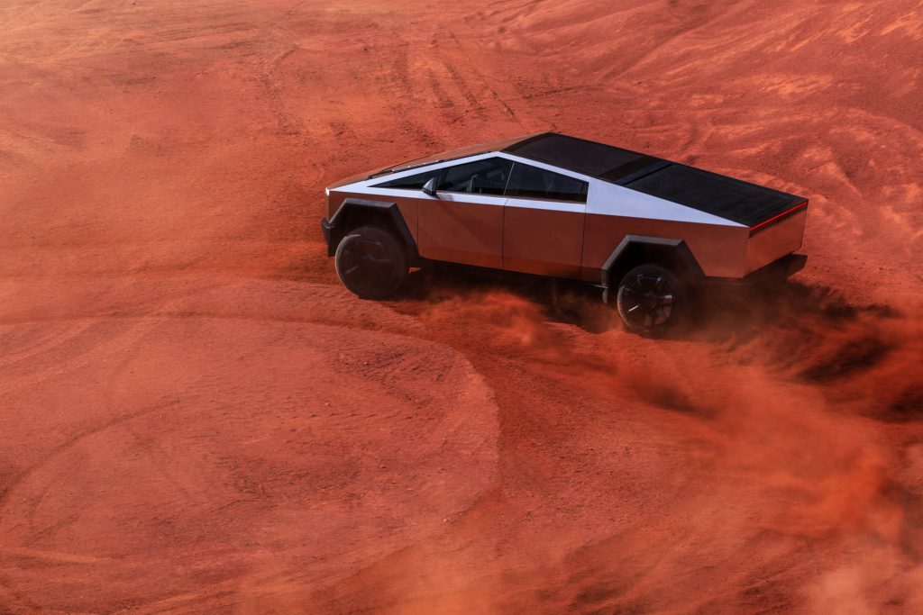 Tesla Cybertruck drifting on red sand