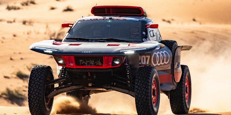 2024 Audi RS Q e-Tron jumping over sand dune during Dakar 2024