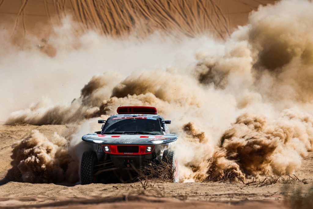 2024 Audi RS Q e-Tron driving through dust during Dakar 2024