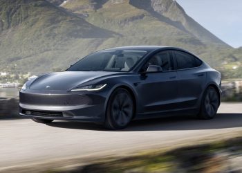 2024 Tesla Model 3 facelift driving past mountains
